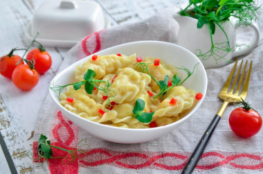 Dumplings on custard dough in boiling water with potatoes