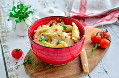 Dumplings on custard dough in boiling water with potatoes