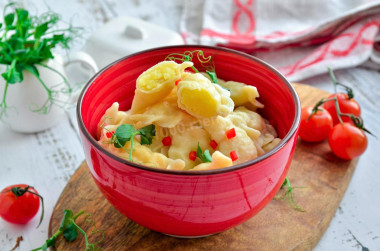 Dumplings on custard dough in boiling water with potatoes