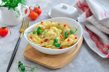 Dumplings on custard dough in boiling water with potatoes