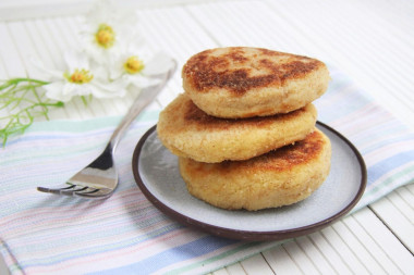 Mashed potato patties in a frying pan