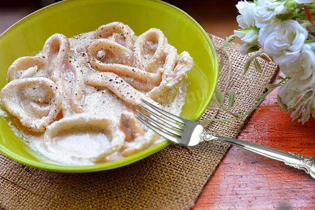 Squid carcasses in sour cream sauce with cumin