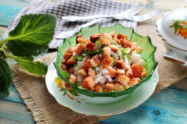 Salad with beans, cakes and sausage