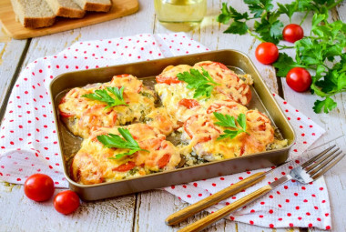 Pork in the oven with cheese and tomatoes