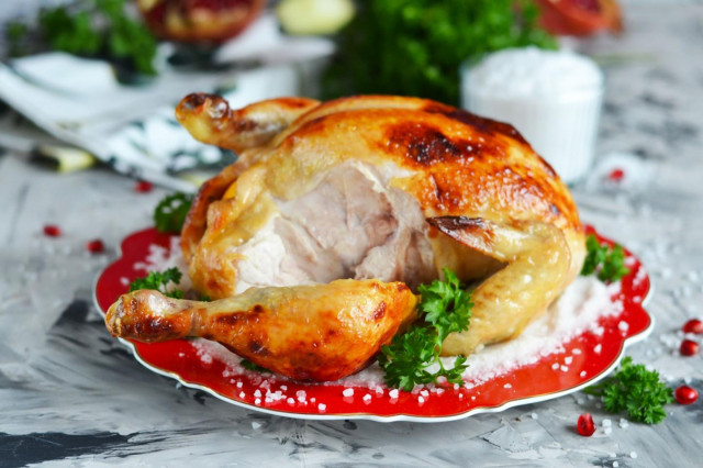 Crispy chicken baked whole in the oven with salt