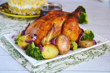 Chicken with a crispy crust baked in the oven in whole