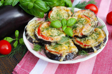 Eggplant with tomatoes cheese and garlic in the oven circles