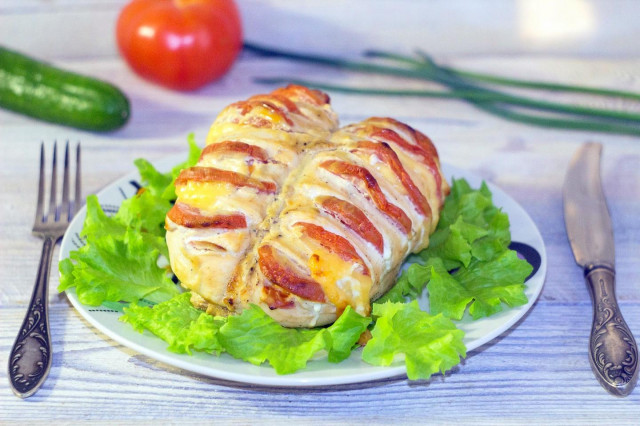 Chicken breasts with tomatoes and cheese in oven