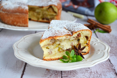 Charlotte with apples in sour cream in the oven