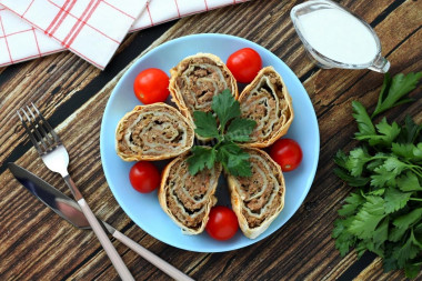 Pita bread roll with minced meat in the oven