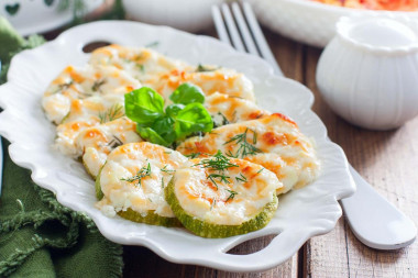 Zucchini baked with cheese in the oven