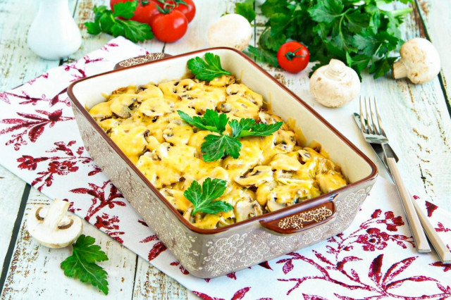 Potatoes with cheese and mushrooms in the oven