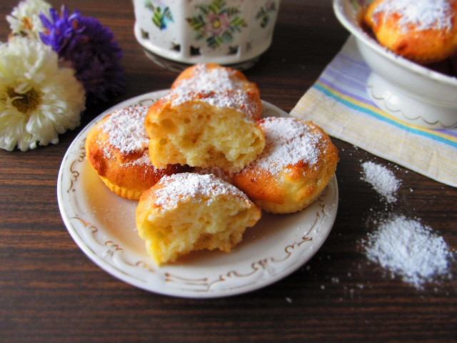 Cottage cheese muffins in molds in the oven