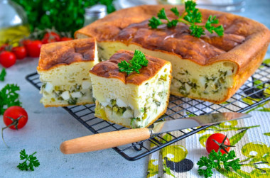 Pie with green onions in the oven