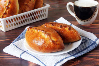 Yeast pies made of dough with milk in the oven