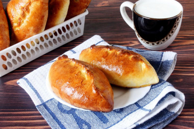 Yeast pies made of dough with milk in the oven