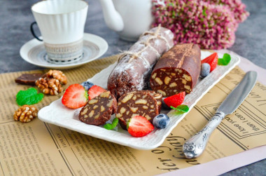 Chocolate sausage with condensed milk from cookies and nuts