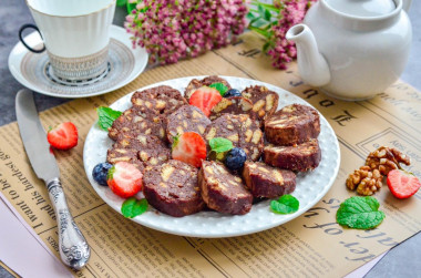 Chocolate sausage with condensed milk from cookies and nuts