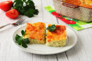 Casserole of zucchini and tomatoes with cheese in the oven