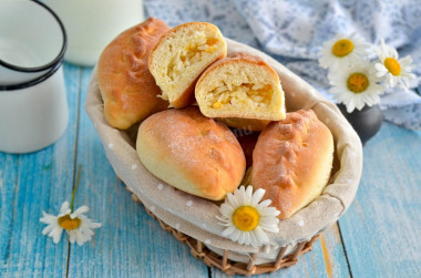 Pies with rice and egg in the oven