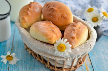 Pies with rice and egg in the oven