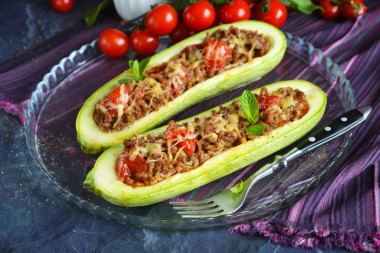 Stuffed zucchini with minced meat and cheese baked in the oven