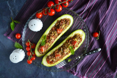 Stuffed zucchini with minced meat and cheese baked in the oven