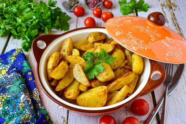 Baked potatoes with garlic in the oven