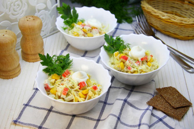 Crab sticks salad with cabbage, corn and egg