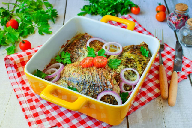 Baked crucian carp in sour cream in the oven