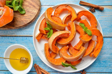 Sweet pumpkin baked in the oven with honey slices