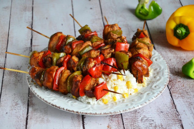 Chicken skewers on skewers in oven