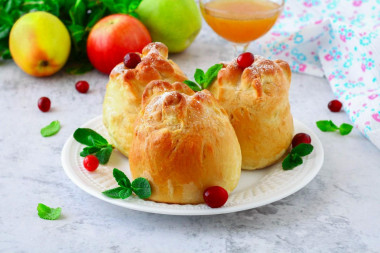 Apples baked in yeast dough in the oven