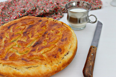 Meat pie in the oven made of yeast dough