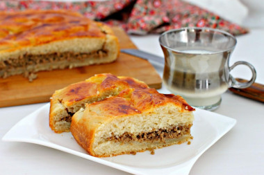 Meat pie in the oven made of yeast dough