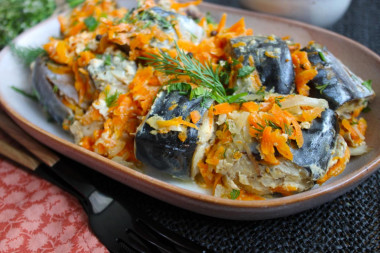 Mackerel in a jar in the oven baked with onions