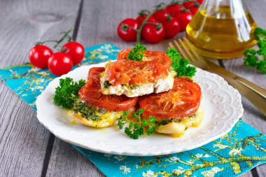 Chicken chop with tomato and cheese in the oven