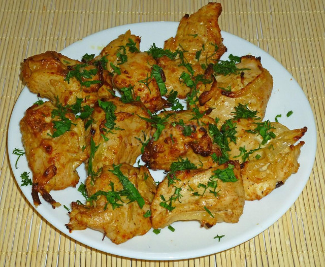 Shish kebab of chicken with onions in oven