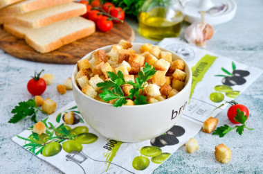 Breadcrumbs in the oven made of white bread with garlic