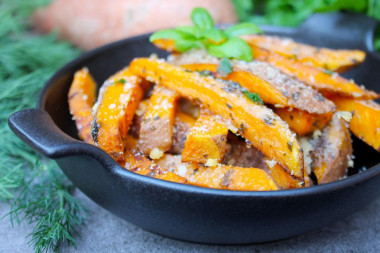 Sweet potato baked in the oven with cheese