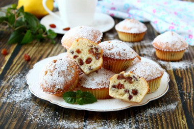 Cupcakes with raisins in silicone molds in the oven