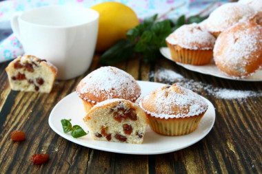 Cupcakes with raisins in silicone molds in the oven