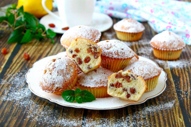 Cupcakes with raisins in silicone molds in the oven