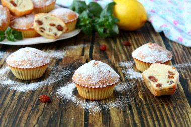 Cupcakes with raisins in silicone molds in the oven