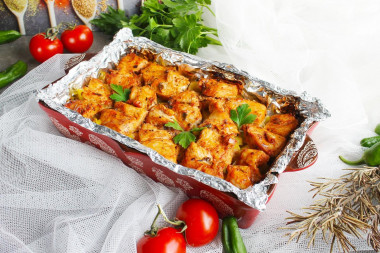 Chicken with potatoes in foil in the oven