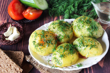 Baked potatoes in foil in the oven