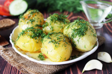 Baked potatoes in foil in the oven