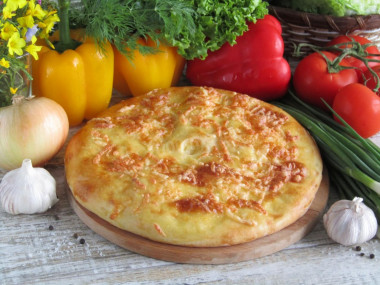 Yeast khachapuri in the oven with cheese