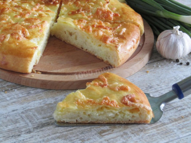 Yeast khachapuri in the oven with cheese