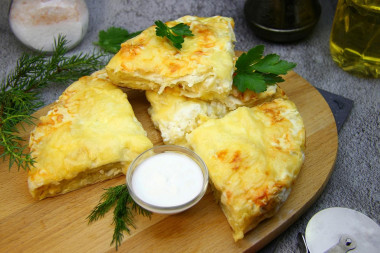 Pita bread khachapuri with cheese in the oven